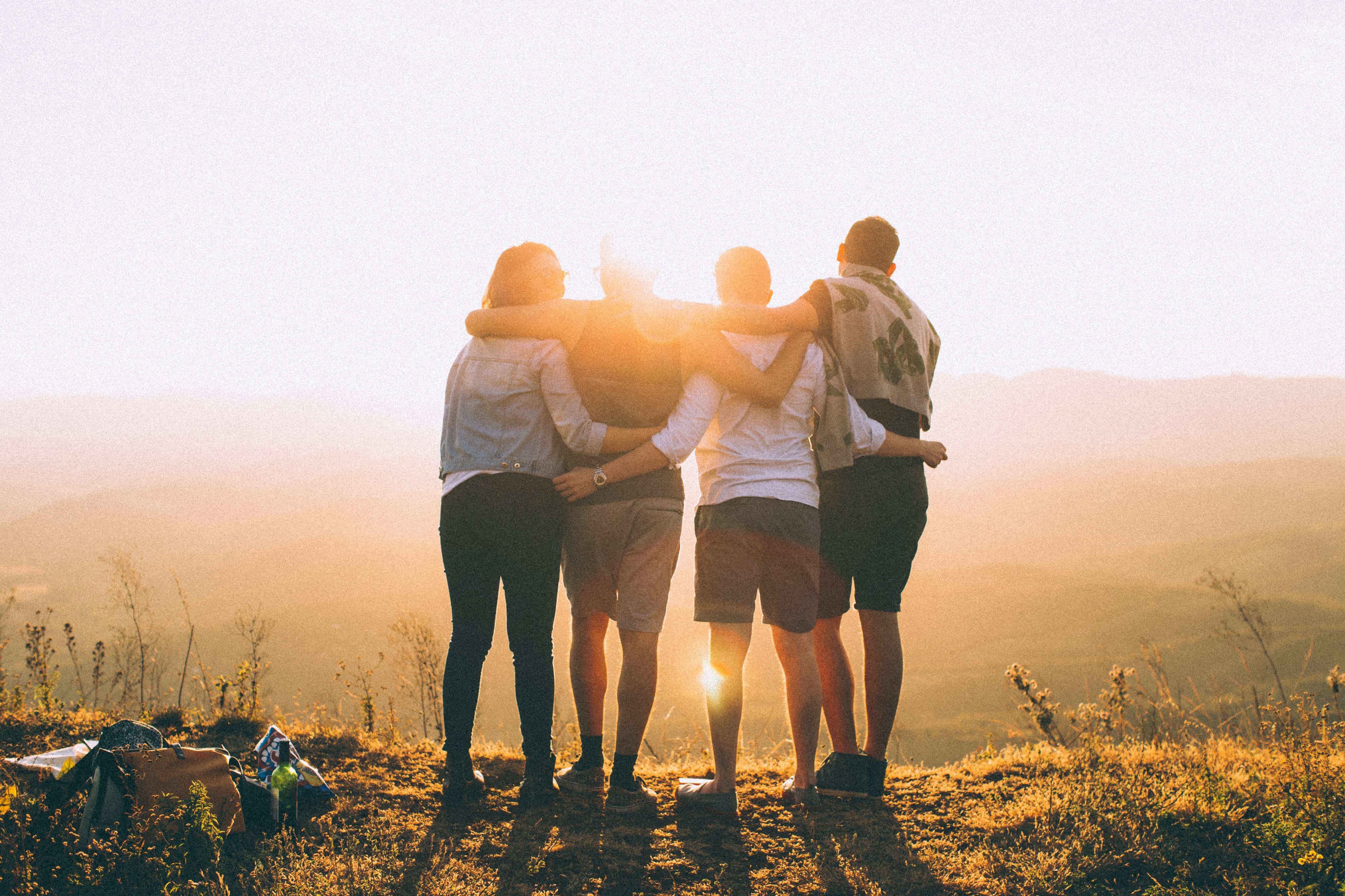 A group of friends arm in arm